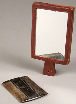 two-sided comb and small wooden-framed hand mirror