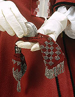close up of gloves and small beaded purse